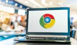 Laptop computer displaying logo of Google Chrome, a cross-platform web browser developed by Google